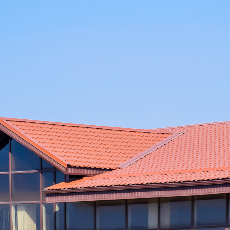 A building with a red tilted roof 