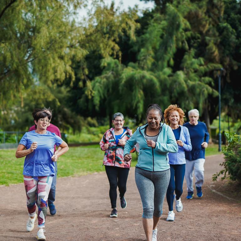 Group of people running in the morning for fitness and health in an outdoor setting