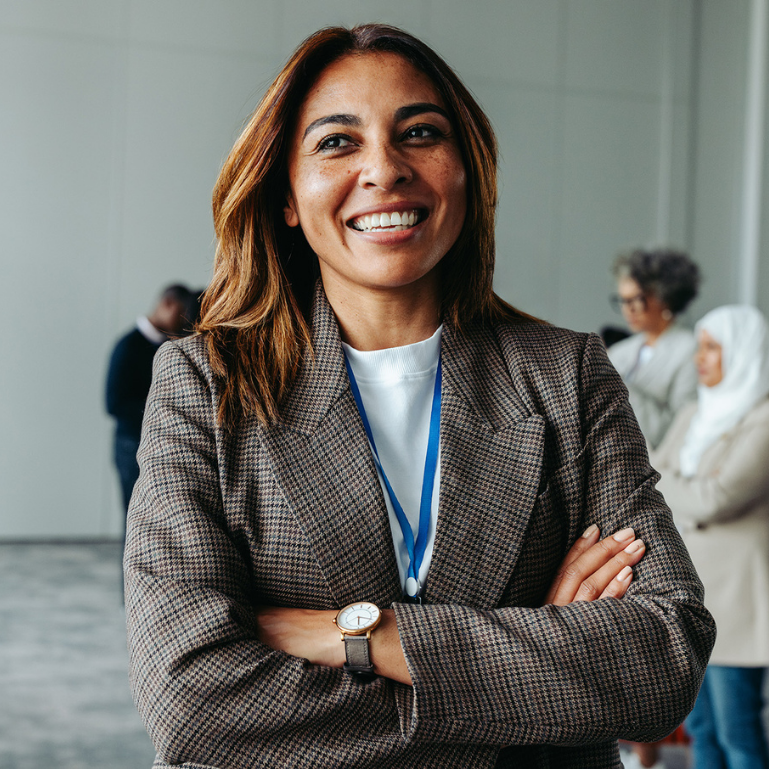 Close-up of women smiling in professional attire